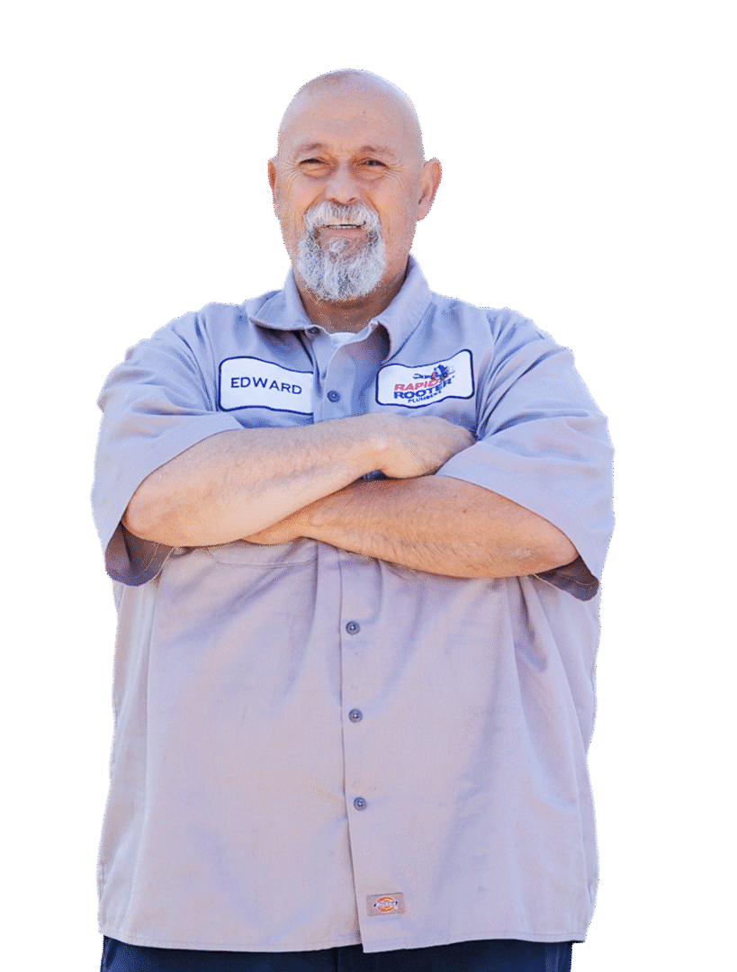 Smiling man with crossed arms, black background.