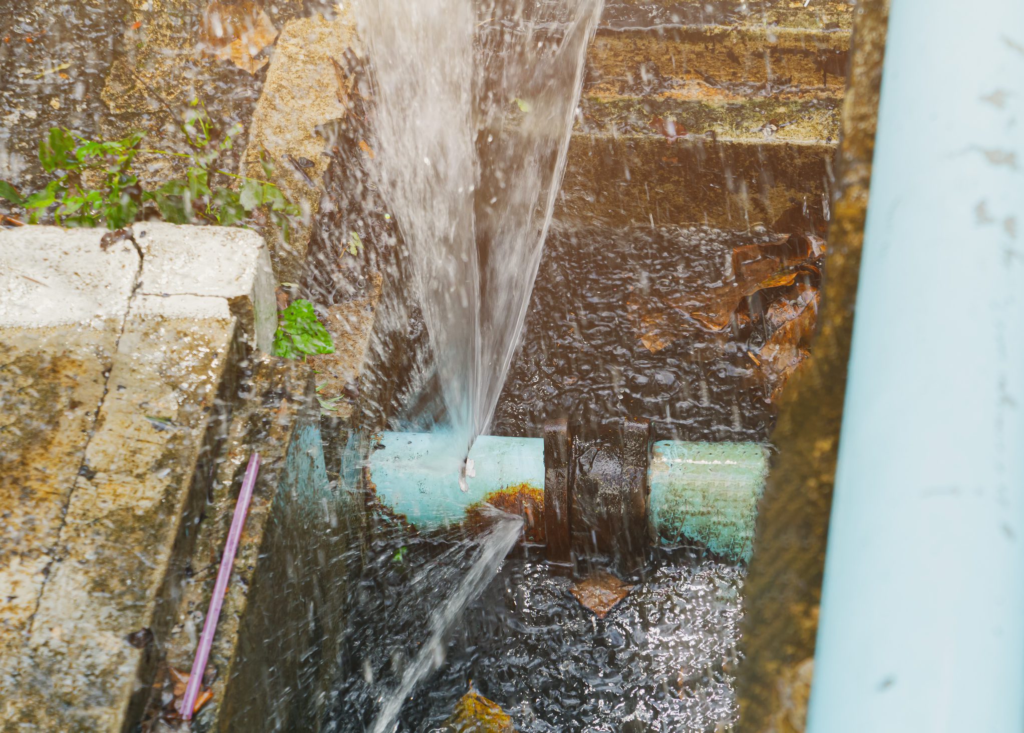 broken pipe in hole ditch at roadside and water Motion