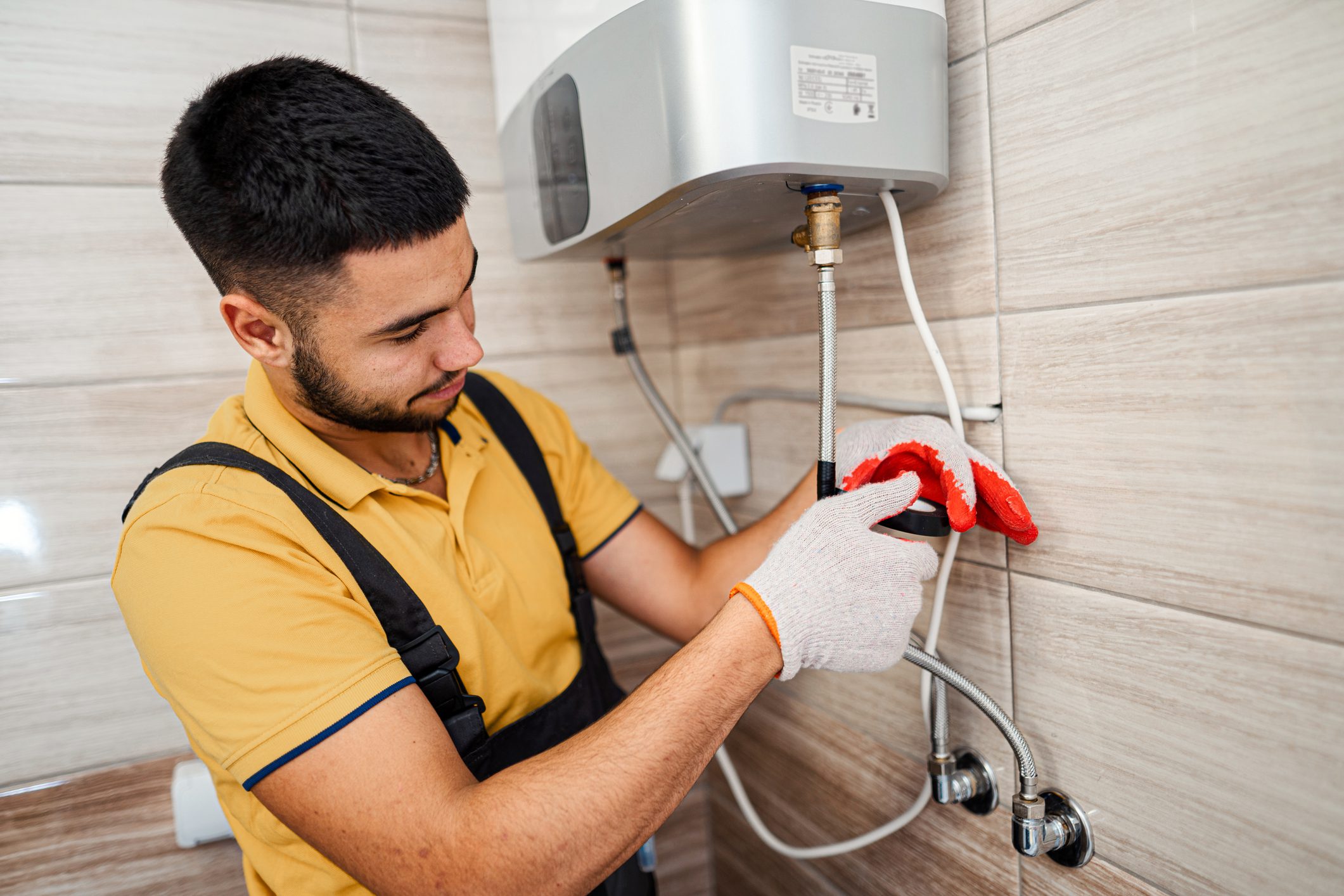 Technician repairing an hot-water heater