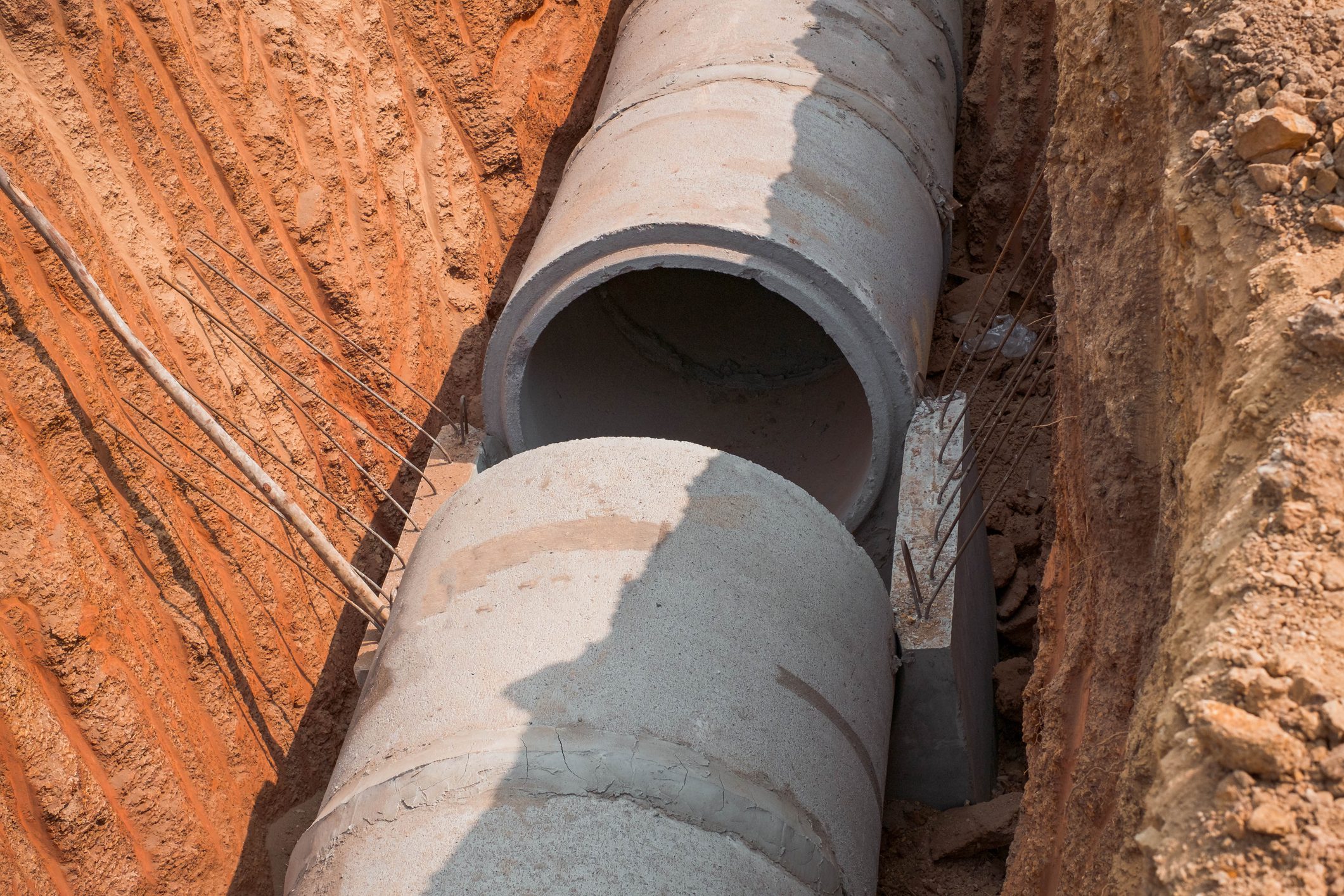 concrete pipeline construction site along the road